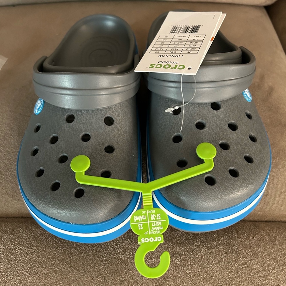 CROCS New size 7 women’s and size 5 in men’s in Gray and Blue